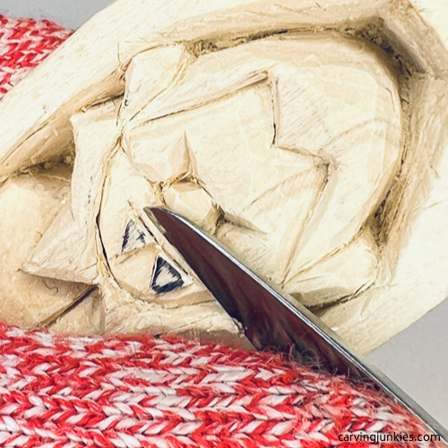 Shaping mouth on wood carved vampire