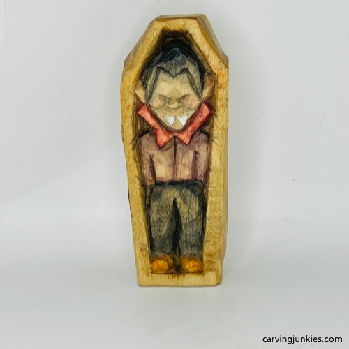 Front view of painted wooden vampire