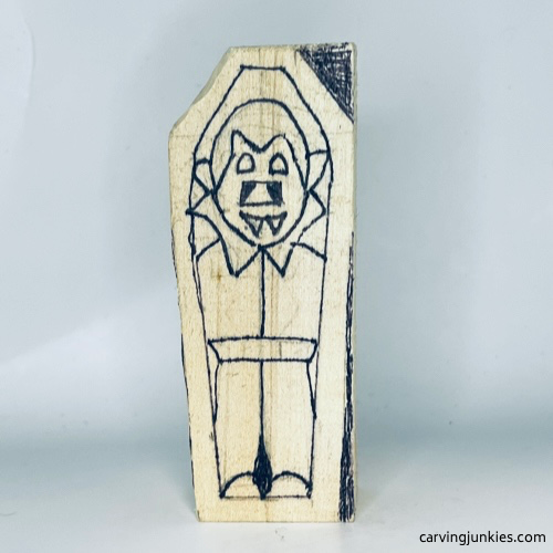 Shaped side of wood carved vampire