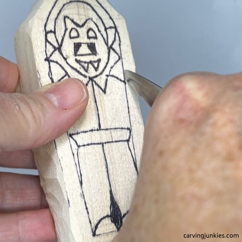 Separating body of wood carved vampire