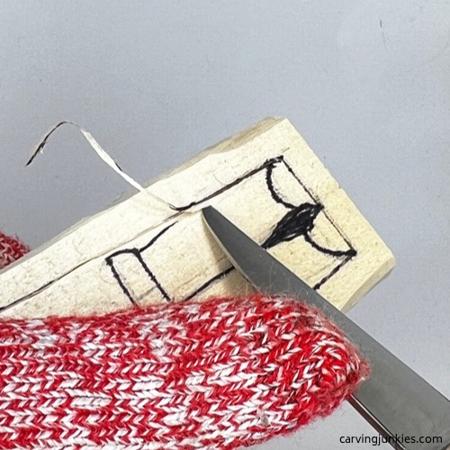 Slicing cut on wood carved vampire