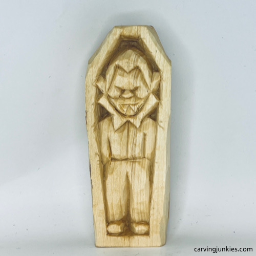 Front view of unpainted wood carved vampire