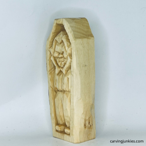 Left view of unpainted wood carved vampire