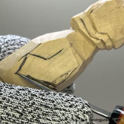 Separating the arms on wood carved Viking