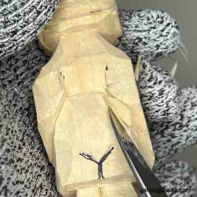 Carving the back of a wood carved Viking