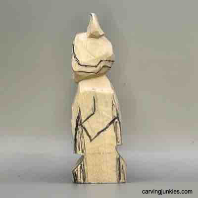 Left details are sketched on wood carved Viking