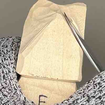 Creating a mound to carve a nose in wood