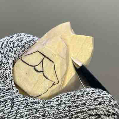 Setting back horns on wood carved Viking