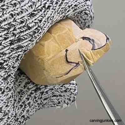 Splitting horns on wood carved Viking