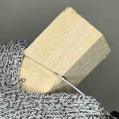 Making a stop cut to carve a wooden Viking