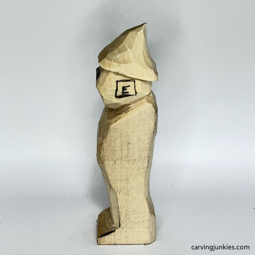 Left ear guideline on wood carved wizard Left ear box on wood carved wizard