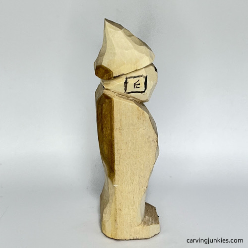 Right ear guideline on wood carved wizard Right ear box on wood carved wizard