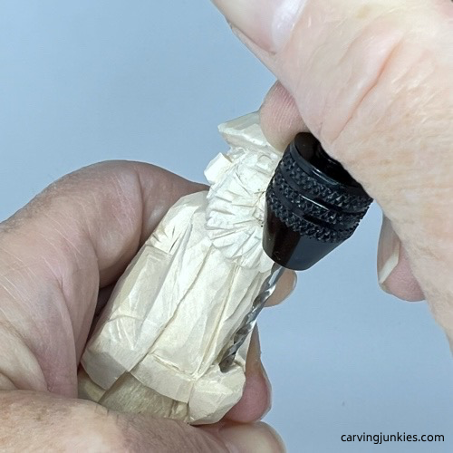 Adding hole on hand of wood carved wizard Drilling hole in hand on wood carved wizard