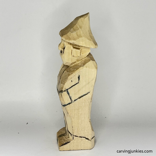 Left side of pants on wood carved wizard Left view of pants on wood carved wizard