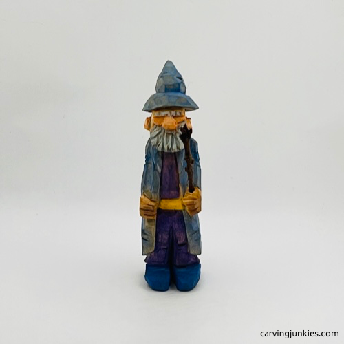 Painted front side of wood carved wizard Painted front view of wood carved wizard