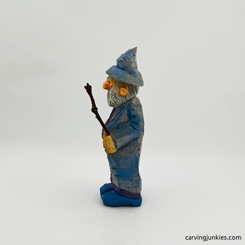 Painted left side of wood carved wizard Painted left view of wood carved wizard