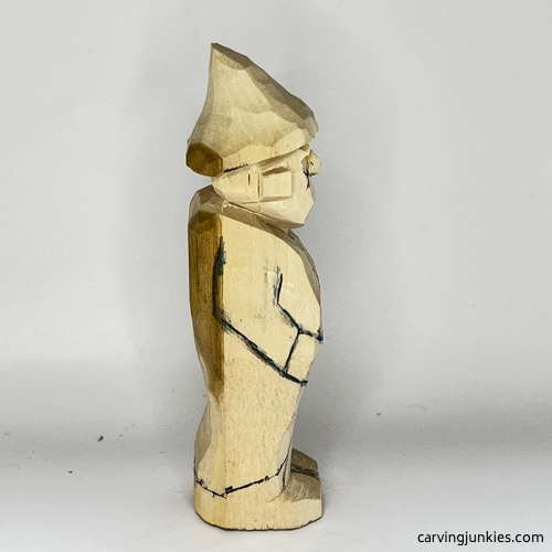 Right side of pants on wood carved wizard Right view of pants on wood carved wizard