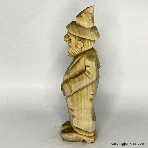 Left side of wood carved wizard Left view of wood carved wizard