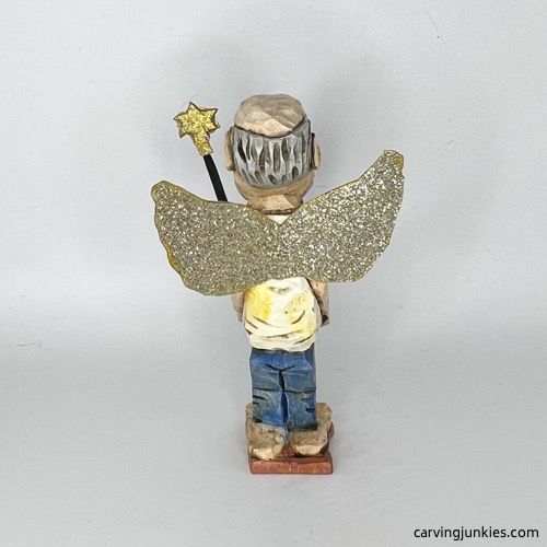 Back side of painted screw-up fairy caricature Back view of painted screw-up fairy caricature