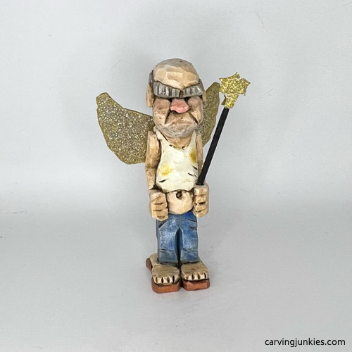 Front side of painted screw-up fairy caricature Front view of painted screw-up fairy caricature