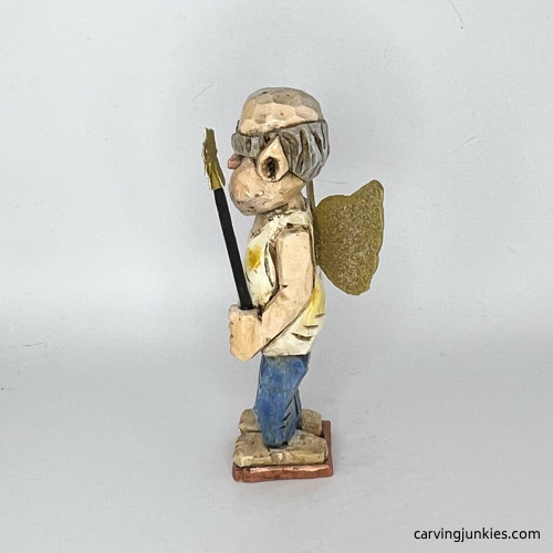 Left side of painted screw-up fairy caricature Left view of painted screw-up fairy caricature