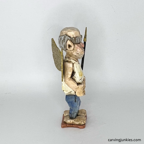 Right side of painted screw-up fairy caricature Right view of painted screw-up fairy caricature