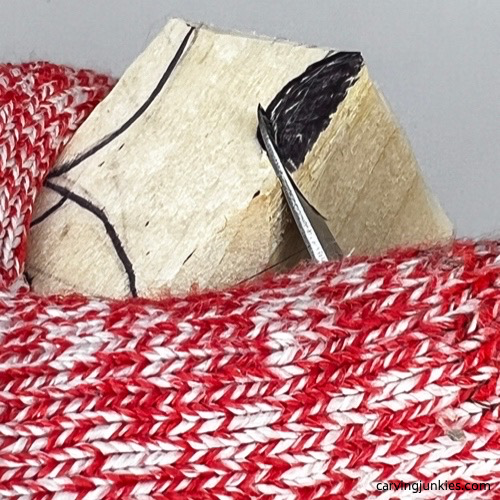 Shaping ear on wood carved fox