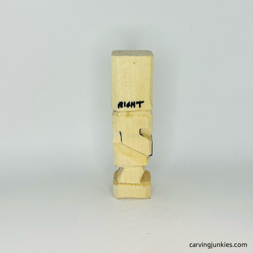 Right arm is cut on carved wooden knight