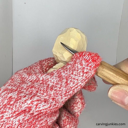 Rounding head on carved wooden knight