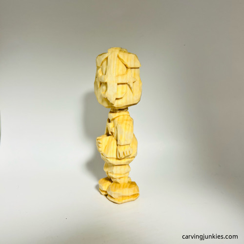 Front view of of carved wooden knight before painting