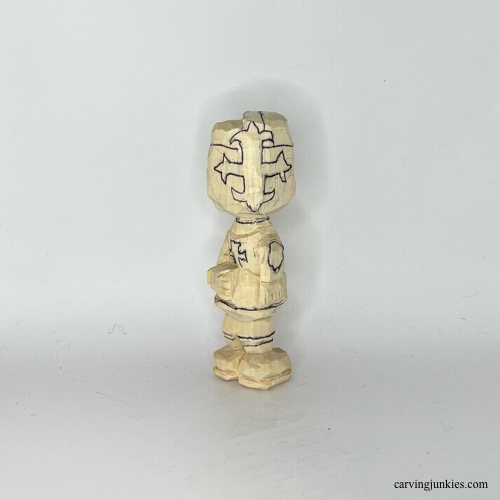 Progress of helmet on carved wooden knight