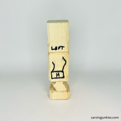 View of left hand on on wooden knight