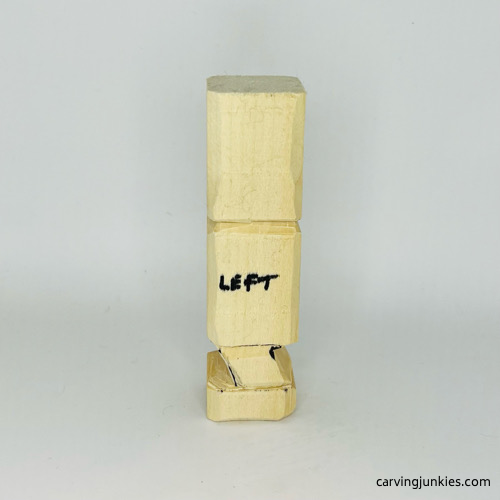 Left view of legs carved on wooden knight