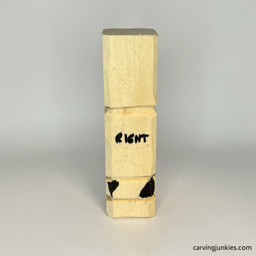 Wood marked for removal on a wooden knight