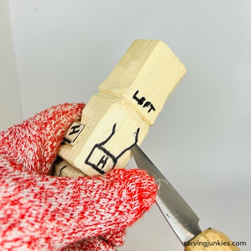 Cutting right arm on carved wooden knight