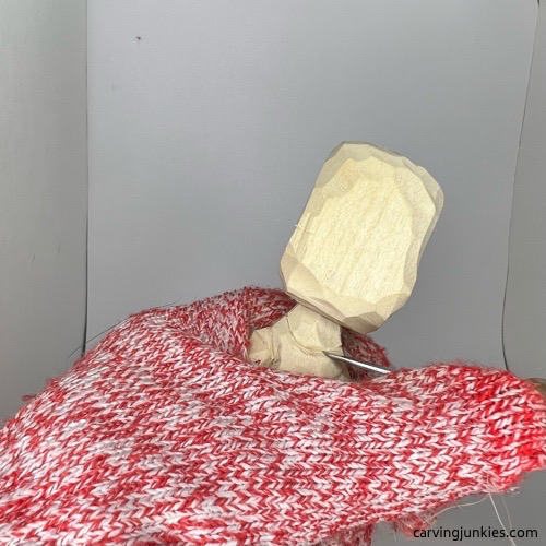 Shaping neck on carved wooden knight