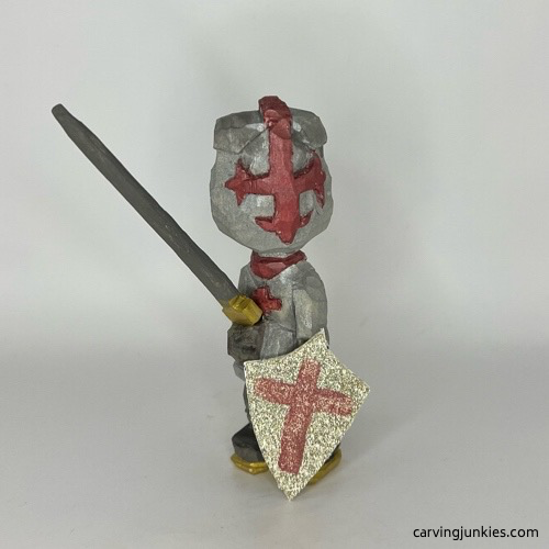 Front view of painted wooden knight