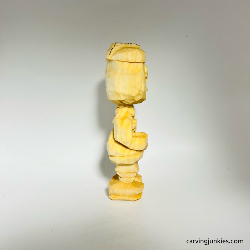 Right view of carved wooden knight before painting