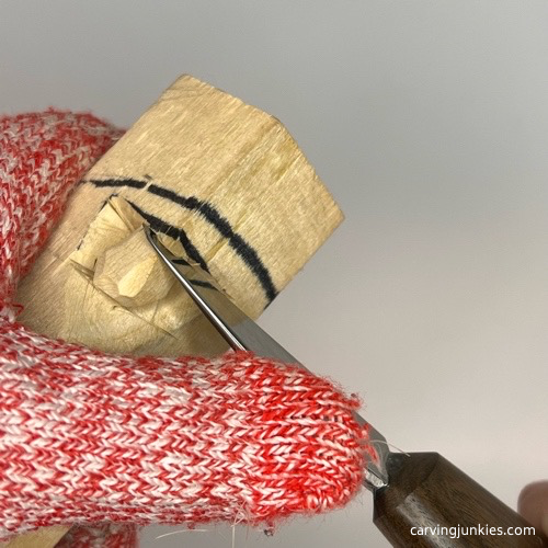 Angling nose on wooden mushroom carving