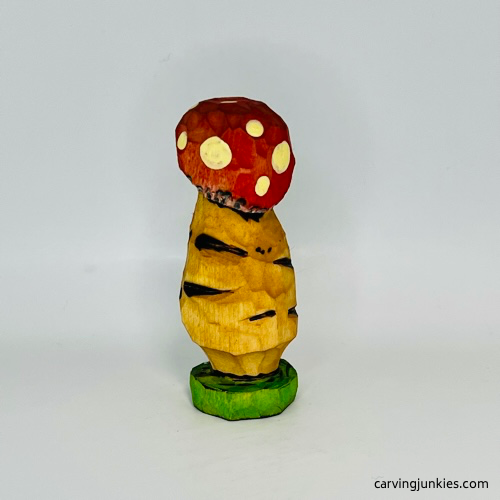 Painted back of wood mushroom carving