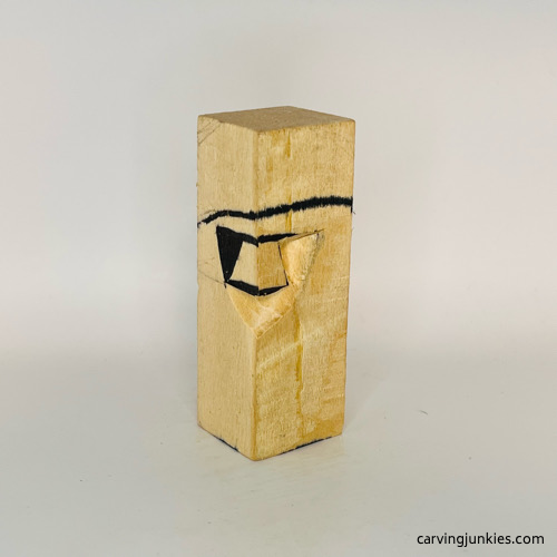 Pyramid cut on wooden mushroom carving