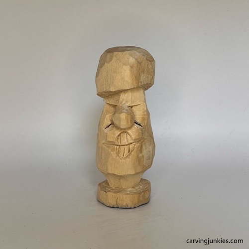 Adding smile lines to wooden mushroom carving