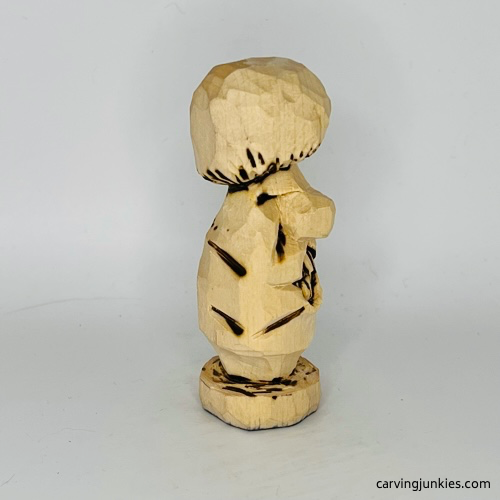 Right view of wood burned details on wooden mushroom carving