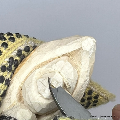 Cutting back bridge of nose on pea pod wood carving Angling bridge of nose on pea pod wood carving
