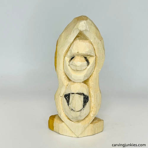 Shaping nose on pea pod wood carving Marking wood to remove on nose of pea pod wood carving