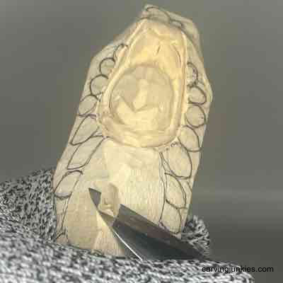 Bring character to your holiday decor with this wooden turkey carving! Shaping the belly of a wooden turkey