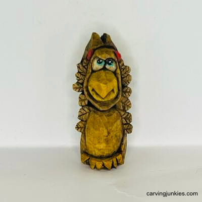 Get ready to impress—carve a wooden turkey masterpiece today! Front of painted wooden turkey