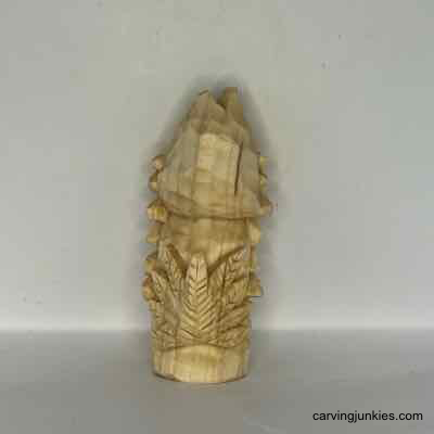 Uncover the secrets of wood carving a charming turkey! Back view of unpainted wood turkey carving