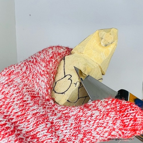 Narrowing back of wooden gnome