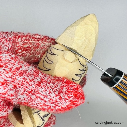 Shaping nose on wooden gnome